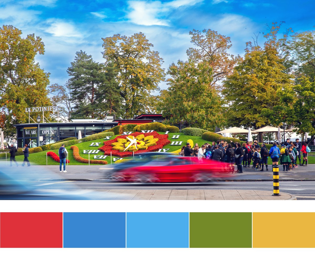 The Horloge Fleurie flower clock in Geneva’s Jardin Anglais on World Watch Day, 10 October 2026, with a red car in motion blur passing in front of the dial and visitors gathered around it. Photograph by Ivan Simeon, Ivan Simeon Studio, Geneva.